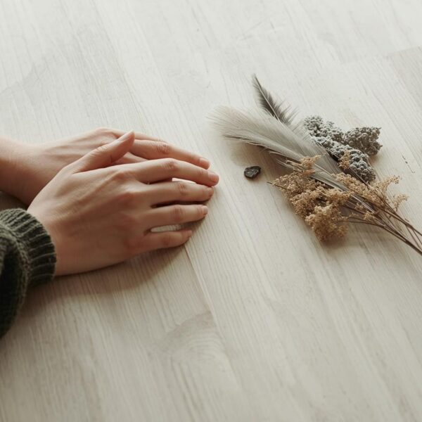 After stillness, hands return to the table